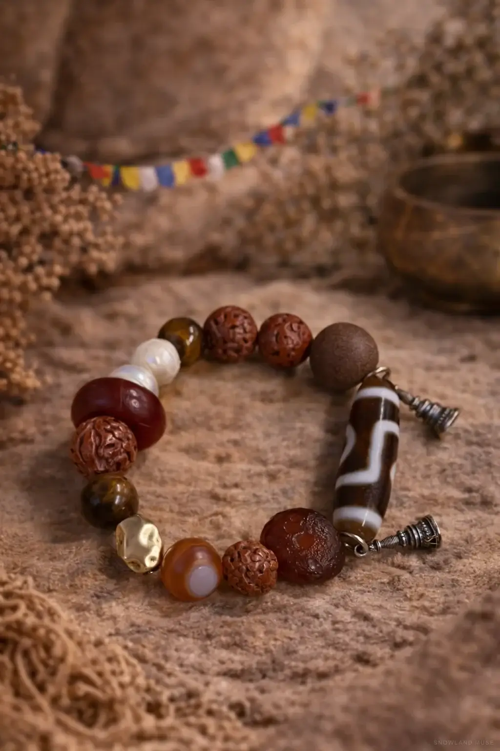 Tiger Eye, Agate & Dzi-Style Bead Bracelet on a neutral background